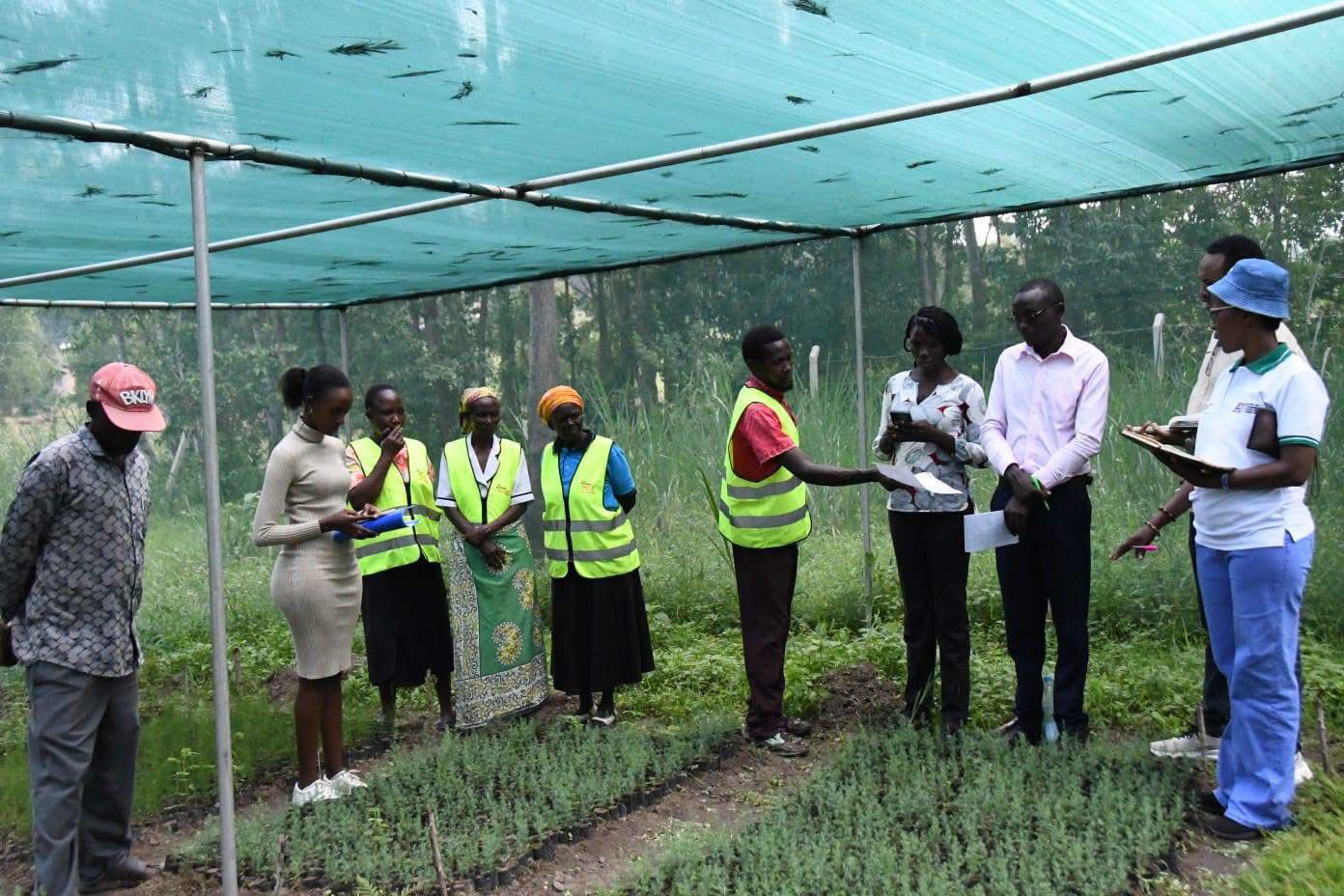 Officials from the state department and Bungoma community members during a onsite engagement.